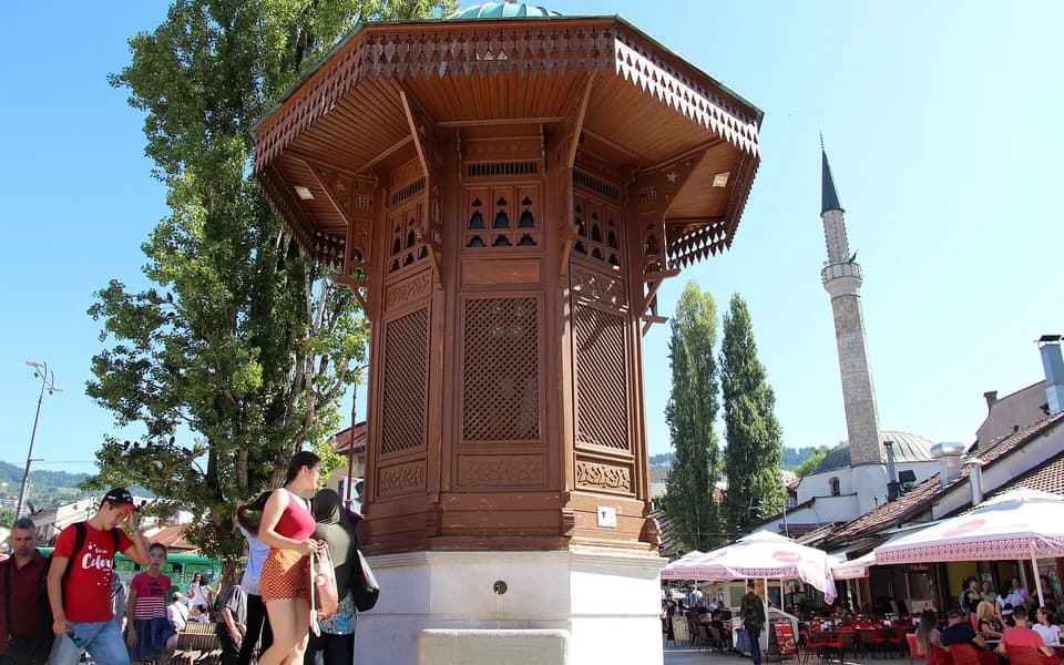 The ornate wooden Sebilj fountain on Sarajevo's Baščaršija main square