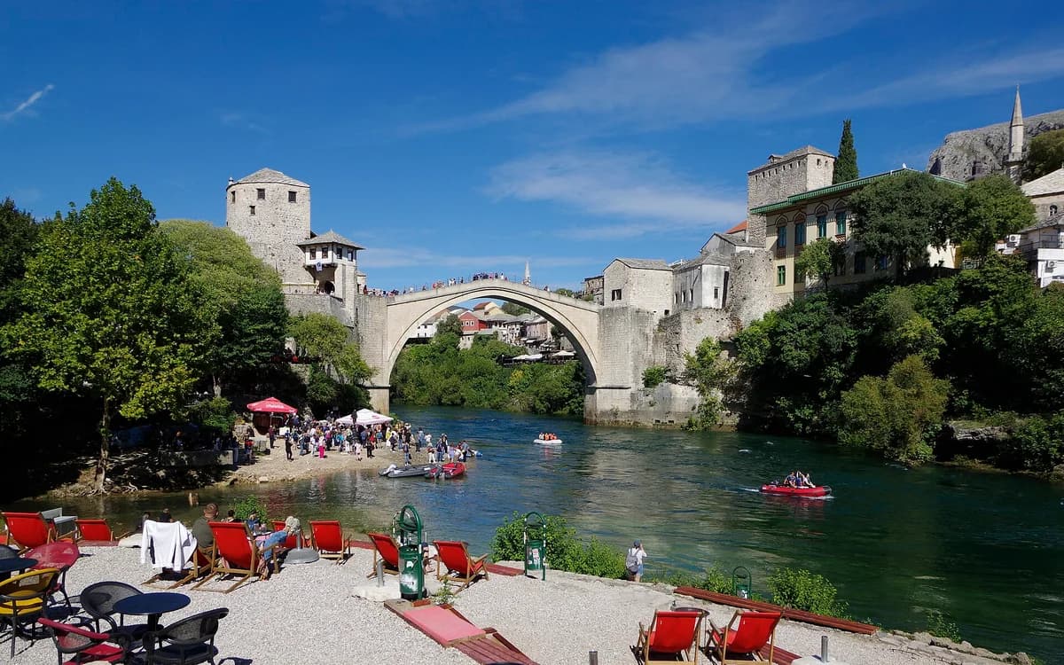 Stari Most bridge above the Neretva with Mostar Old Town on both banks