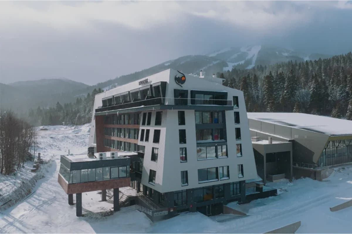 Aparthotel Phoenix building beside snow-covered slopes on Bjelašnica