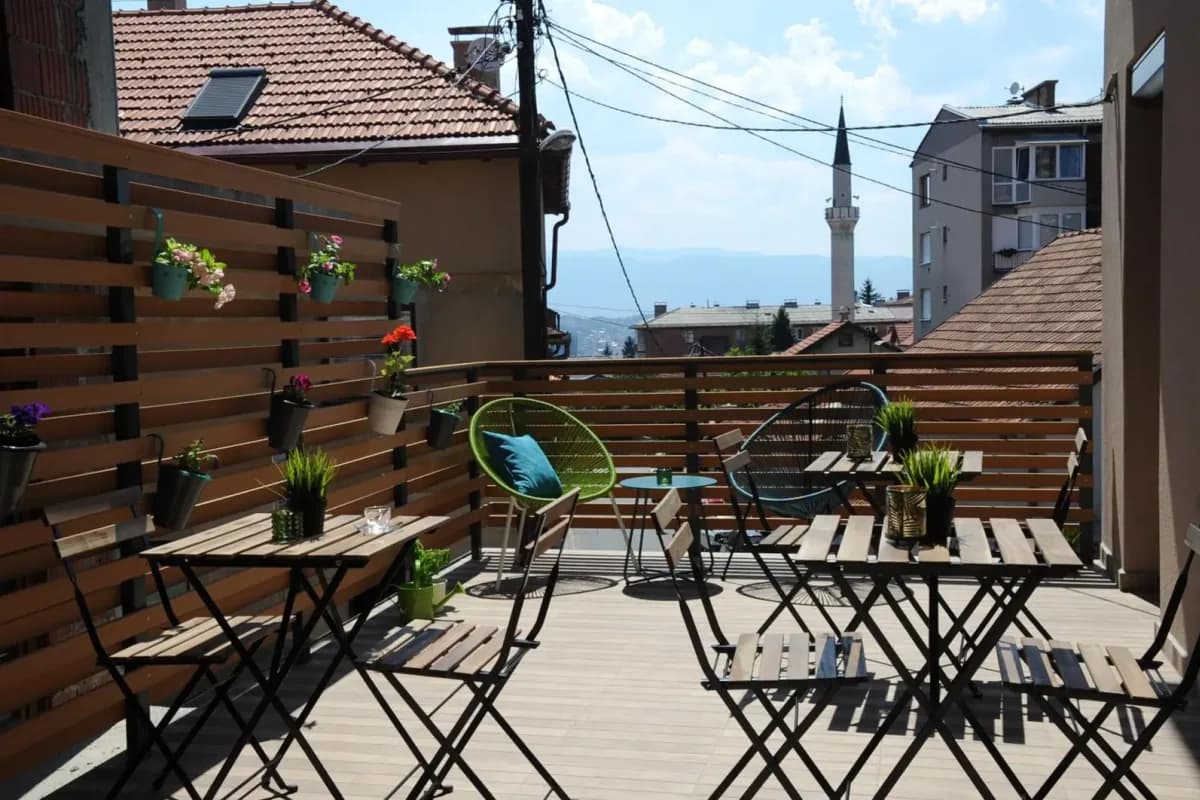 Shared rooftop terrace and seating at Hostel Kucha in Sarajevo