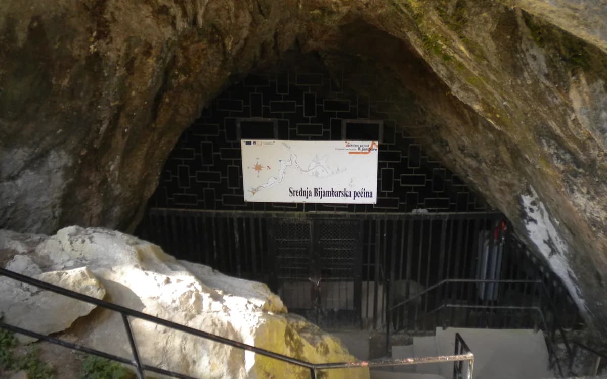 The actual entrance to Middle Bijambare Cave with visitor railings and an entrance sign