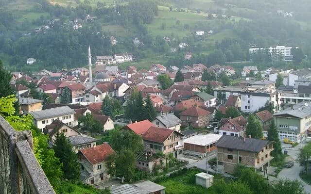 Real town of Fojnica viewed across its houses and hillside, not the Reumal facility or swimming pool